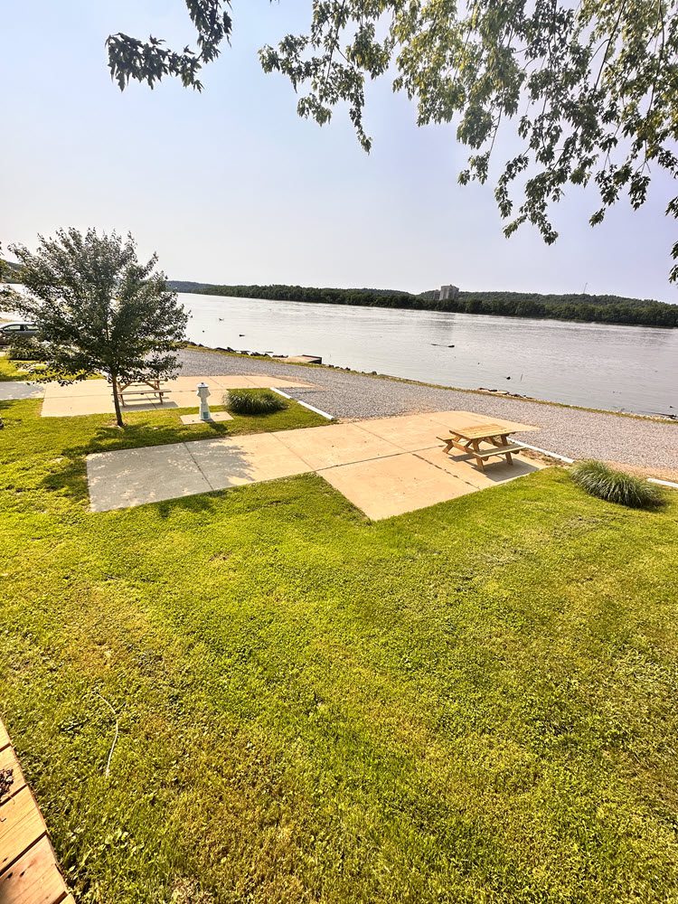 Lakeside view camping area in campground with picnic area. Smuggler's Cove Marina & Campground Warsaw Kentucky.